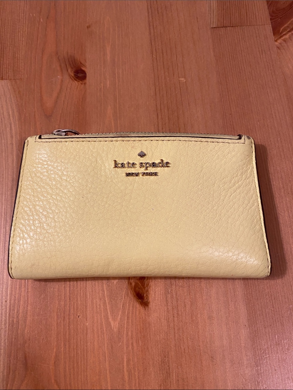 kate spade pale yellow pebble leather zip wallet